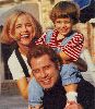 Jett Travolta with Kelly Preston and John Travolta at happy times