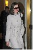 Anne Hathaway : wearing a white double-chest coat over a black skirt heading towards a building in New York City, yesterday s afternoon 5th January 2009