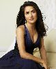 Salma Hayek in a glam navy dress that shows her breast cleavage