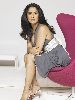 Salma Hayek HQ photo sitting on a pink couch