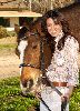 Shannen Doherty photo beside a horse