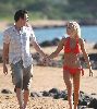 Jenny McCarthy : spotted wearing an orange bikini and walking on Hawaii Beach together with Jim Carrey on the 5th, Jan 2009