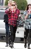 Lindsay Lohan : spotted sipping  cola soda wearing a black tight leggings and a large red and black shirt with her hair tied back in california yesterday 5th January 2009