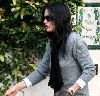 Courtney Cox : spotted in Beverly Hills on January 5th 2009 wearing a gray sweater and a black neck scarf with matching brown-dark shaded sunglasses