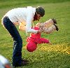 Marcia Cross : flipping one of the twins at the park in Pacific Palisades where she was playing whole-heartedly with the two cute grils on January 5th 2009