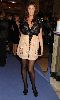 Lisa Snowdon in a chiffon cream-beige and black dress