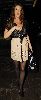 Lisa Snowdon in a cream-beige and black layered dress