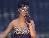 Rihanna stills from a concert wearing an eye-mask