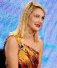 Drew Barrymore wearing a one-shoulder yellow dress at the press TV HBO interview