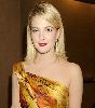 Drew Barrymore in an orange and yellow patterened dress