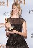 Laura Dern holds her Golden Globe Award for winning Best Performance by an Actress in a Supporting Role in a Series, Mini-Series or Motion Picture Made for Television