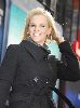 Jenny McCarthy holding a sign for the Suave Beauty Stimulus campaign launch on January 14th 2009