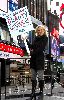 Jenny McCarthy holding a sign for the Suave Beauty Stimulus campaign launch on January 14th 2009