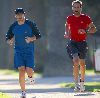 Jake Gyllenhaal running with his his personal trainer on Wednesday in Santa Monica, California 14th of January 2009