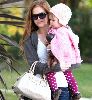 Isla Fisher holding her 13 months old daughter in Santa Monica, California on the 11th of January 2009