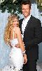 Fergie : in her wedding dress with her husband Josh Duhamel in his black suit