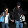 Sarah Michelle Gellar holding Freddie Prinze Jrs hand at LAX on Jan 11th, 2009