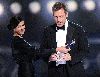 Teri Hatcher presents an awards for Hugh Laurie at the 35th annual Peoples Choice awards