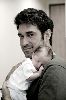 Burak Hakki holding his baby