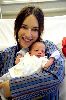 sema simsek holding her cute new born baby