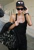 Paris Hilton : spotted talking on her mobile phone wearing a black cap and sunglasses after she visits the Tanning Salon in Beverly Hills, California, on the 24th of January 2009