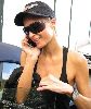 Paris Hilton : talking on her mobile phone wearing a black cap and sunglasses after she visits the Tanning Salon in Beverly Hills, California, on the 24th of January 2009