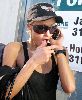 Paris Hilton : spotted talking on her phone wearing a black cap and sunglasses after she visits the Tanning Salon in Beverly Hills, California, on the 24th of January 2009