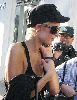 Paris Hilton : candids talking on her mobile phone wearing a black cap and sunglasses after she visits the Tanning Salon in Beverly Hills, California, on the 24th of January 2009