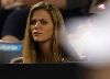 Brooklyn Decker watching a tennis game of her fiance