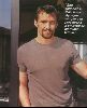 Actor hugh jackman wearing a brown t-shirt