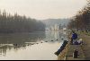 Cities Europe Belgium : An early morning fisherman fishing in the Meuse River.