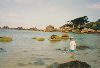 Cities Europe France : a man fishing along the coast with a net