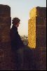 Cities Europe France : A man looking out from the walls of Carcassonne at the town below.