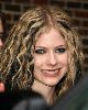 Avril Lavigne in a wavy black and blond hair