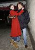 Anne Hathaway wearing a red double-chest coat