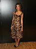 Jessica Alba attends a fashion show wearing a tiger printed dress